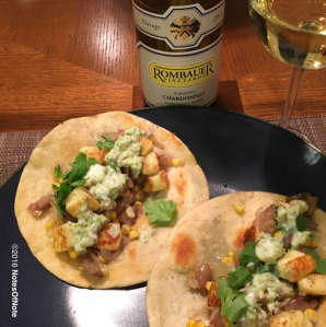 Queso tostadas with summer vegetables and a spicy cream sauce.